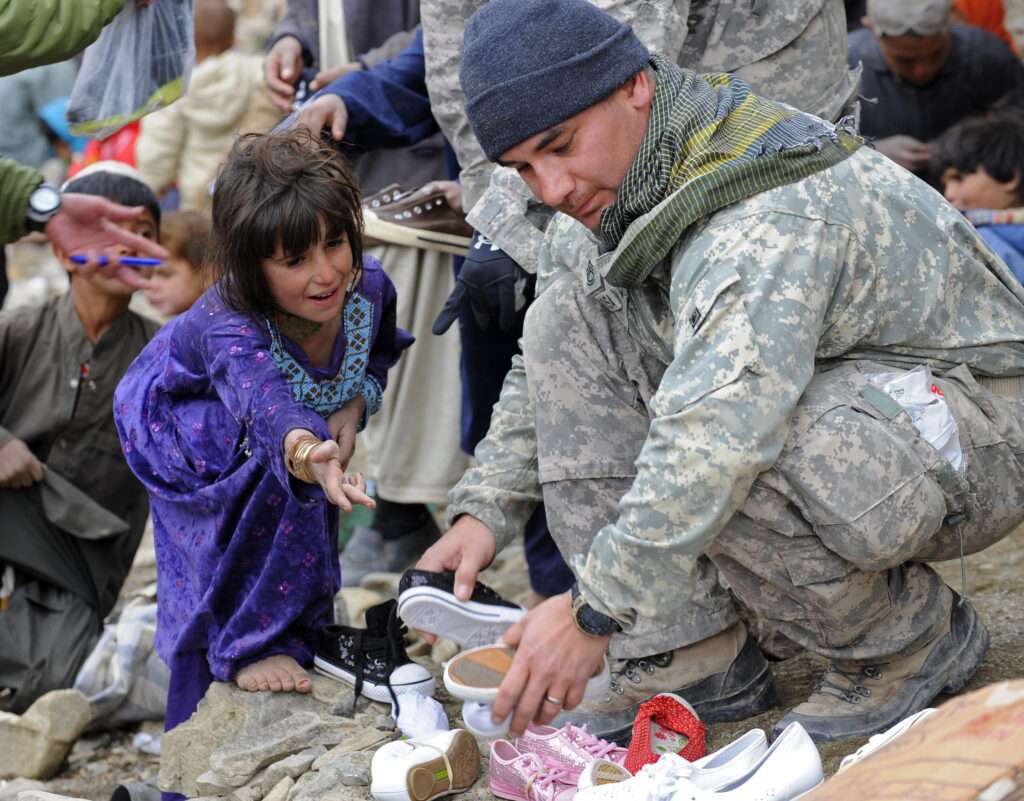 soldier giving shoes 1