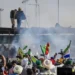 farmers protest tear gas shells fired at protesting