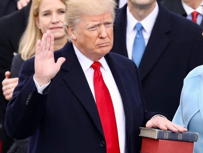 Donald Trump Swearing-in ceremony, Donald Trump Inauguration 2025, Trump Swearing Ceremony, Washington D.C. events, Make America Great Again speech, Chief Justice John Roberts Trump Oath, Virginia Trump Golf Club, टेक सीईओ इन Inauguration, गुलाबी कैप प्रोटेस्ट, National Prayer Service Trump, Trump Oath indoor ceremony, U.S. President inauguration updates, Indian Foreign Minister S. Jaishankar U.S. visit, Trump National Cemetery tribute, J.D. Vance Vice President ceremony.