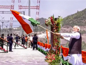 PM Narendra Modi waves the Tiranga as he inaugurates Chenab bridge Anji Bridge in Jammu and Kashmir