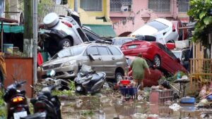 Vehicles lie piled on after flooding caused by Typhoon Kalmaegi in Cebu city, central Philippines, Tuesday, Nov. 4, 2025. (AP Photo/Jacqueline Hernandez)