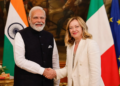 बड़ा फैसला: India Italy Special Strategic Partnership में अपग्रेड, Defense Deal पर मुहर 2 Image Prompt: Indian Prime Minister Narendra Modi and Italian Prime Minister Giorgia Meloni shaking hands warmly in an elegant diplomatic hall in Rome, both smiling with confidence, Indian and Italian flags visible in background, Melody toffee pack subtly visible on a table beside them, professional diplomatic photography, cinematic lighting with warm golden tones, photorealistic, 8k resolution, high detail, official state visit atmosphere, --ar 16:9 (1200 x 675 pixels HD size) --no text
